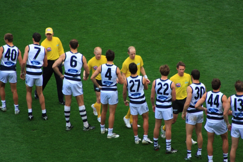 GEELONG PLAYERS SHAKE HANDS WITH UMPIRES