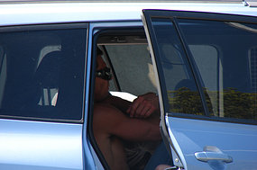 BEN COUSINS IN THE BACK OF HIS CAR PRIOR TO ARREST 