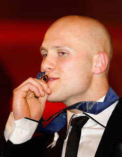 BROWNLOW MEDALLIST GARY ABLETT GETS CLOSE ACQUAINTED WITH HIS PRIZE