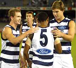 TOM HAWKINS WITH JOEL SELWOOD AND TRAVIS VARCOE AFTER THEIR ROUND 2 WIN OVER CARLTON