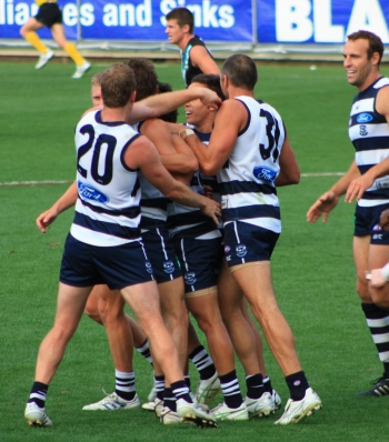 ALLEN CHRISTENSEN IS MOBBED AFTER KICKING HIS FIRST EVER AFL GOAL