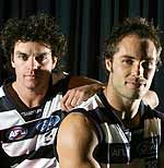 SCARLETT AND DUAL-PREMIERSHIP SKIPPER TOM HARLEY BEFORE THEIR 100TH GAMES IN 2002